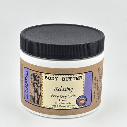 Jar of body butter with a black lid on a gray background