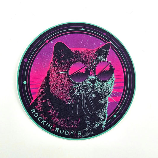 Circular sticker with a cat wearing sunglasses and 'Rockin' Rudy's' text on a white background