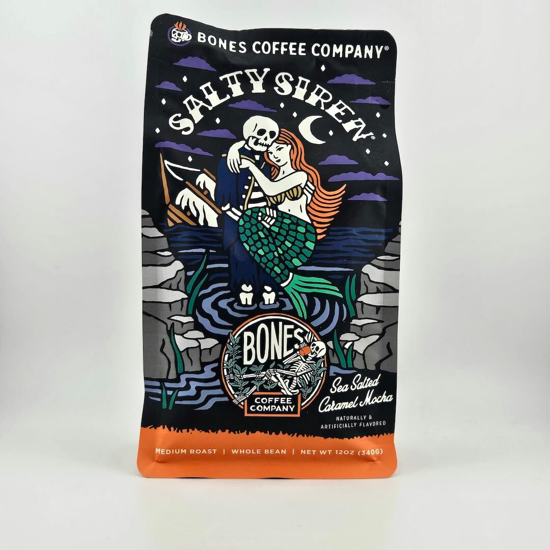 Black coffee bag with "Bones Coffee Company" branding and skeleton illustration. 