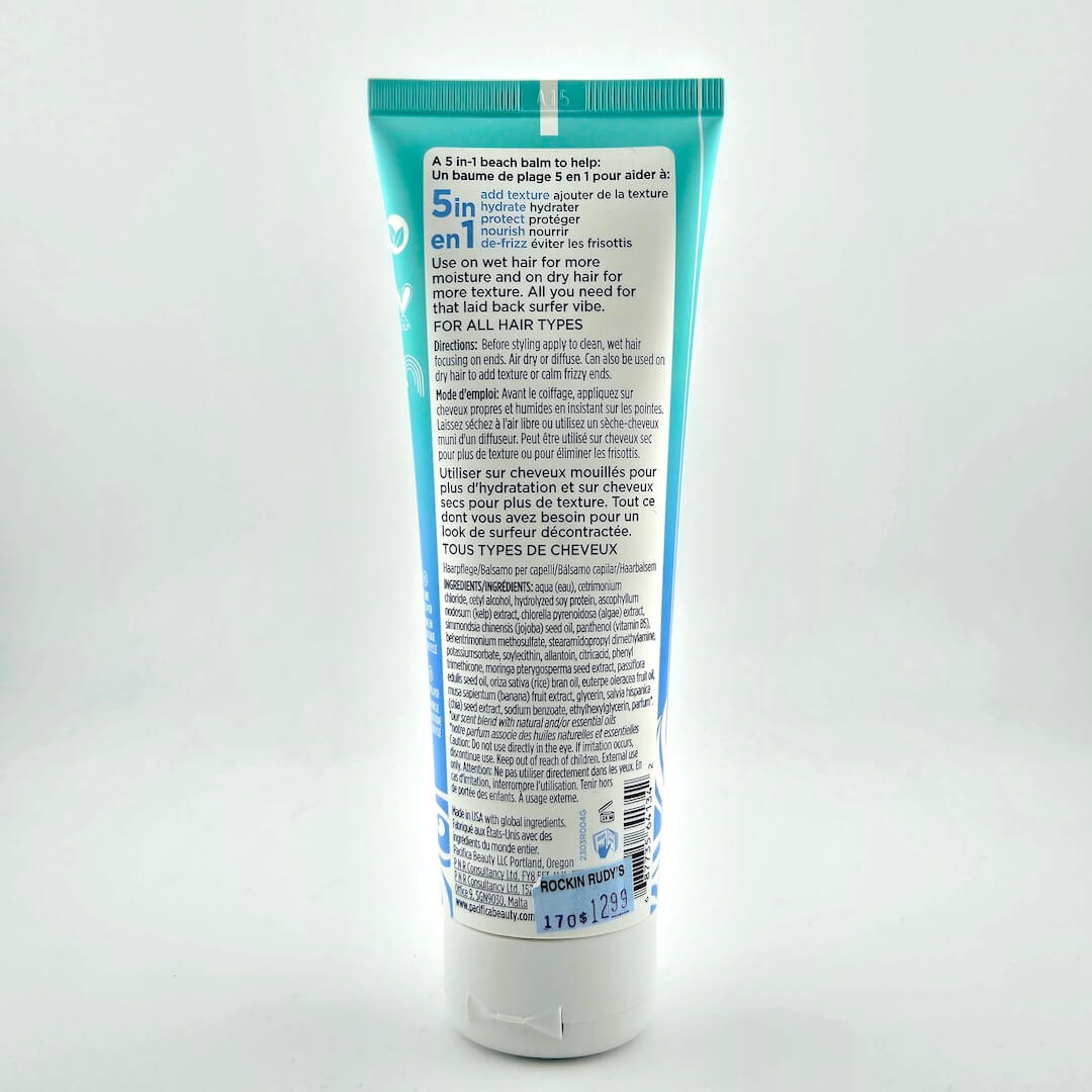 Back view of a blue and white hair product tube on a white background