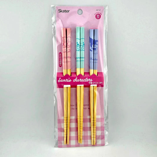 Pink packaging for three sets of chopsticks against white background.