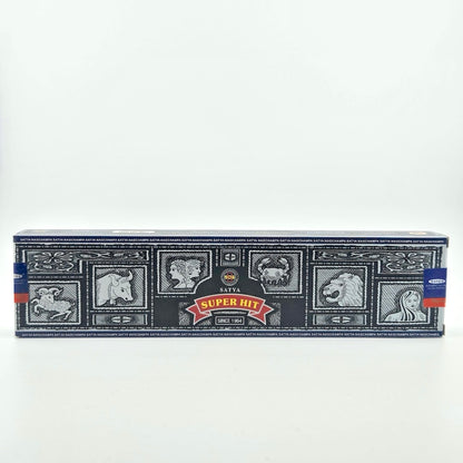 Black box with tile motif, red banner with scent name at center under company name.