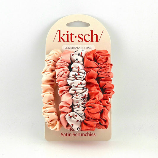 Set of satin scrunchies in pink and red shades on a 'kitsch' branded card.