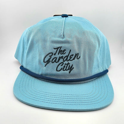 Light blue cap with 'The Garden City' text on a white background
