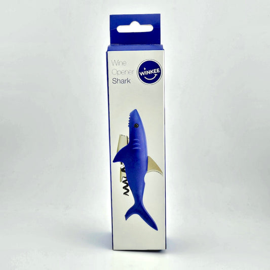 Blue and white packaging for shark shaped bottle opener against white background.