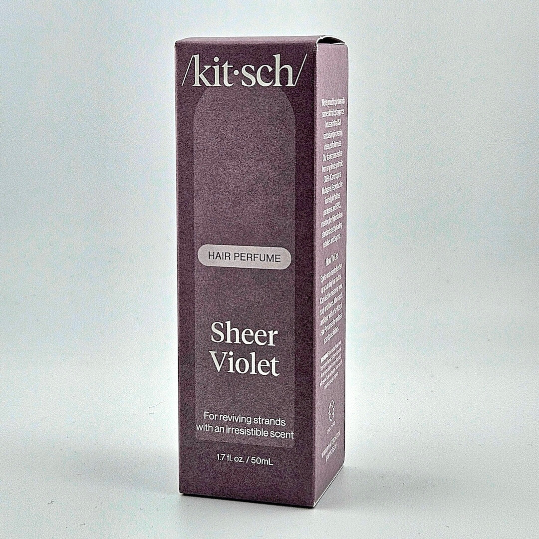 Kitsch Sheer Violet hair perfume box on a light gray background