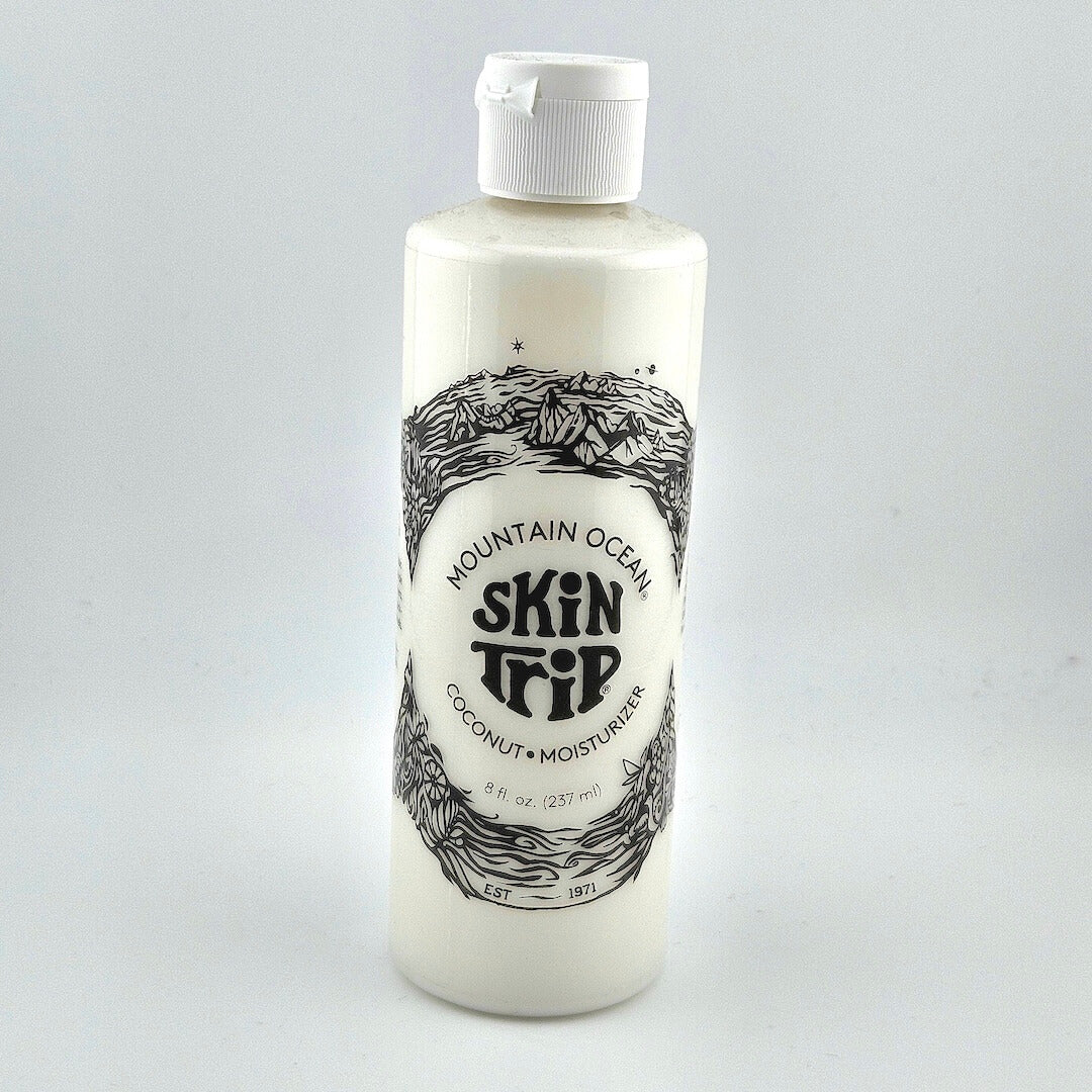 Bottle of Mountain Ocean Skin Trip coconut moisturizer on a white background