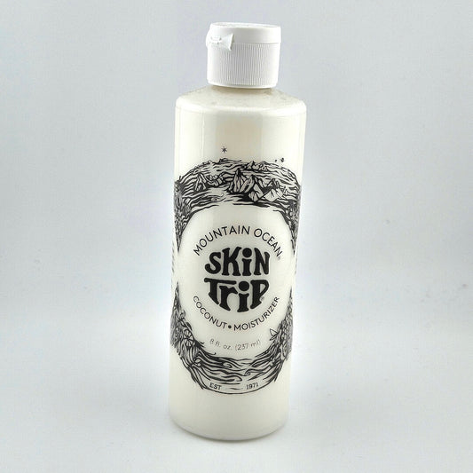 Bottle of Mountain Ocean Skin Trip coconut moisturizer on a white background
