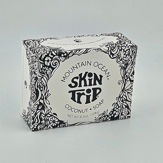Box of Mountain Ocean Skin Trip Coconut Soap with decorative black patterns on a gray background