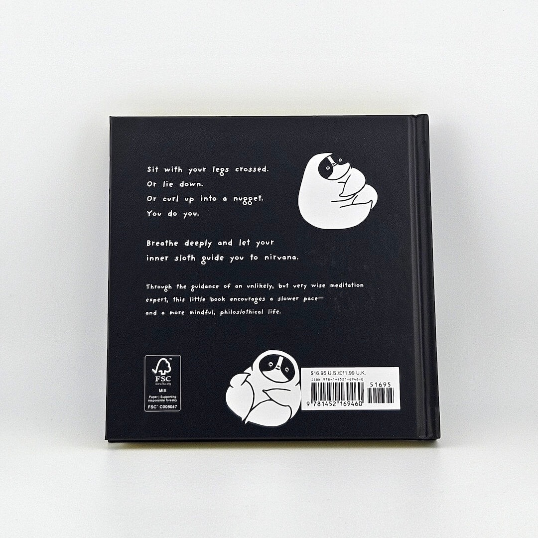 Backside of black book with summary and barcode against white background. 
