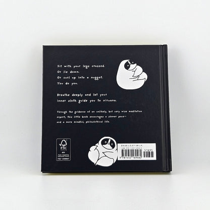 Backside of black book with summary and barcode against white background. 