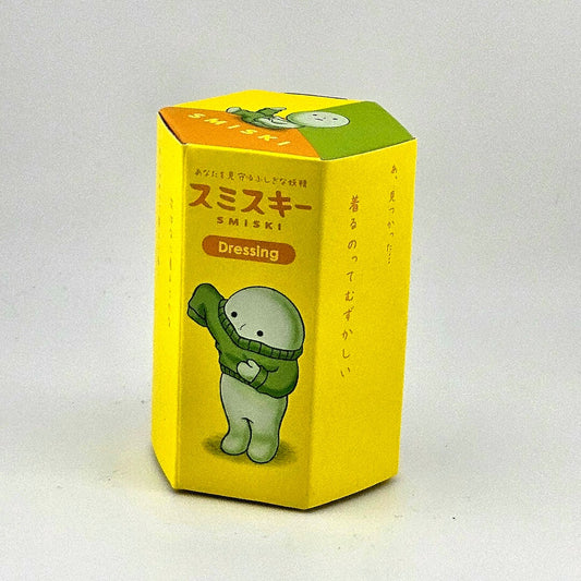 Yellow packaging box with cartoon character and text on a white background