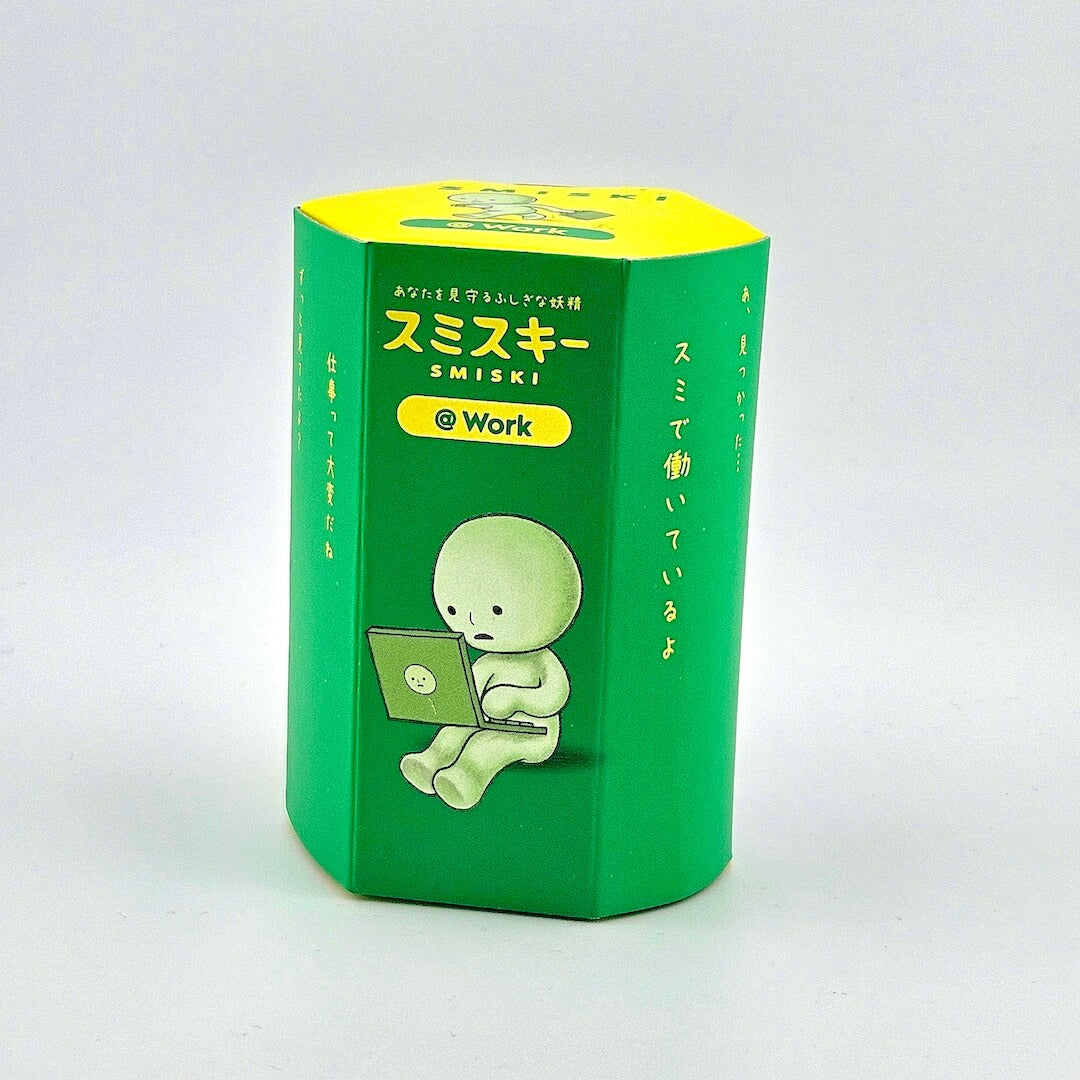 Green and yellow box with cartoon character and text on a white background