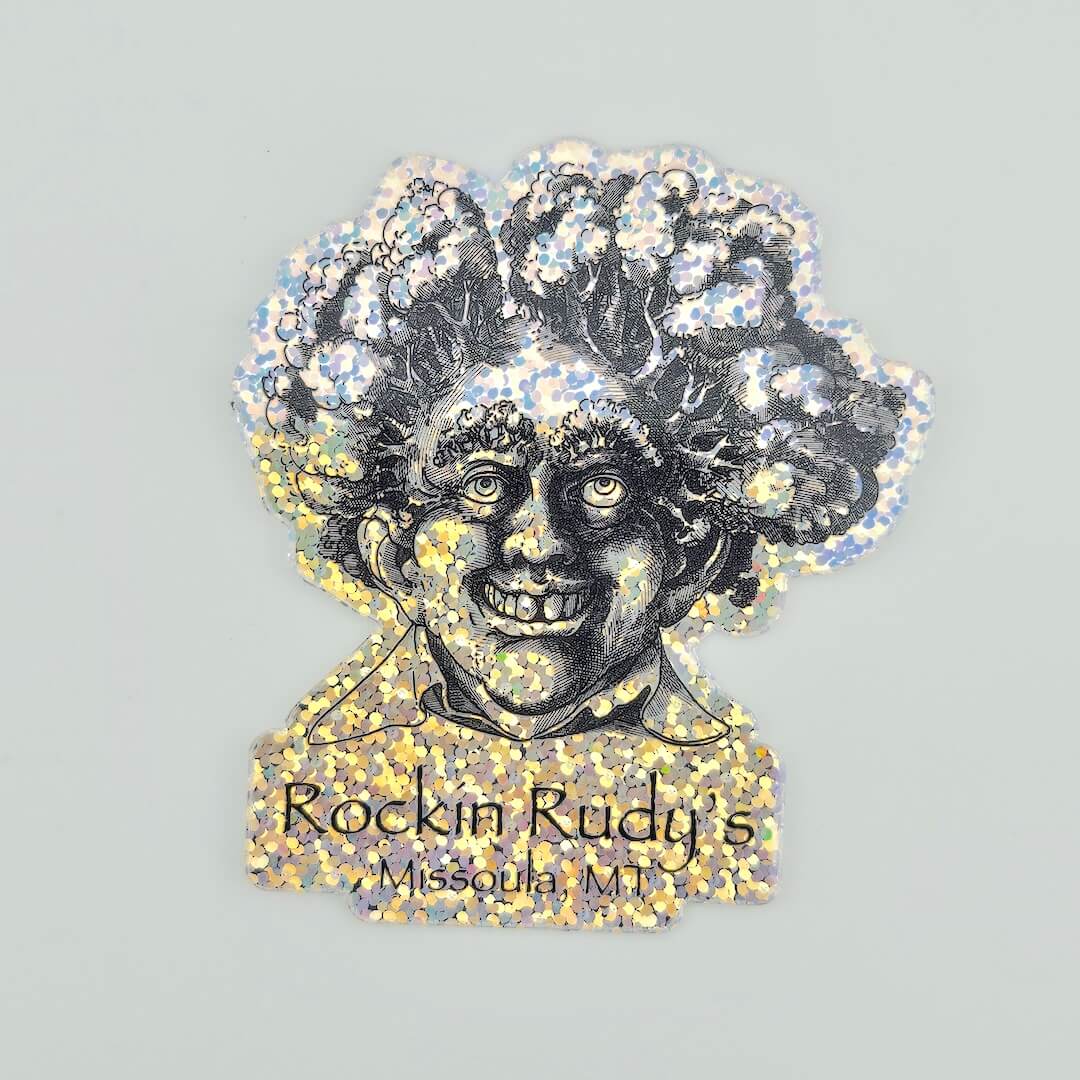 Illustration of a person with a broccoli afro and glittery accents, featuring the text 'Rockin Rudy's Missoula, MT'.