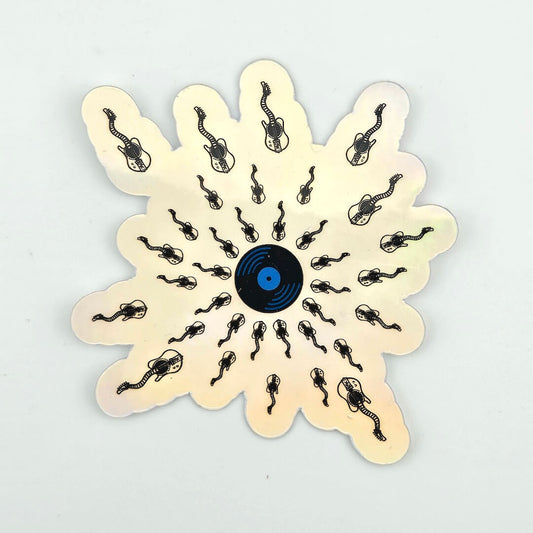 Holographic sticker with sperm guitar design with record at center, set against gray background.