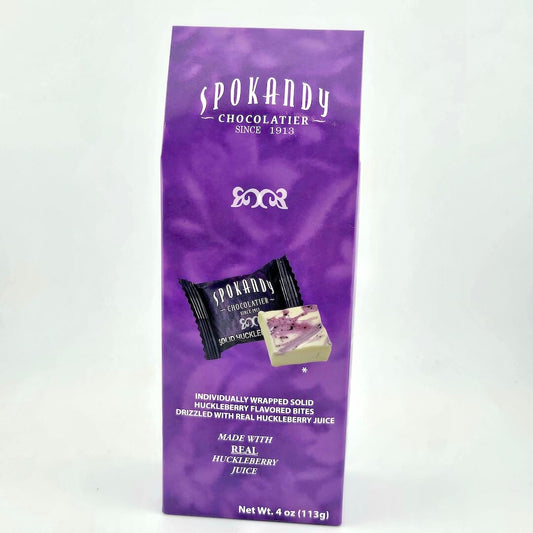 Spokandy Chocolatier purple packaging with product images on a white background