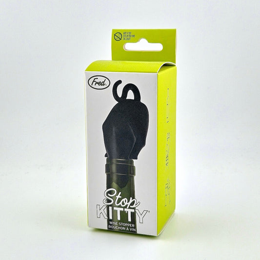 green packaging for cat shaped wine stopper against white background.