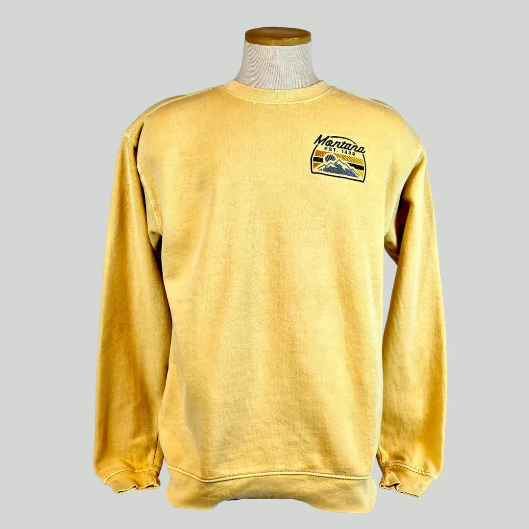 Yellow sweatshirt with a logo on a mannequin against a white background