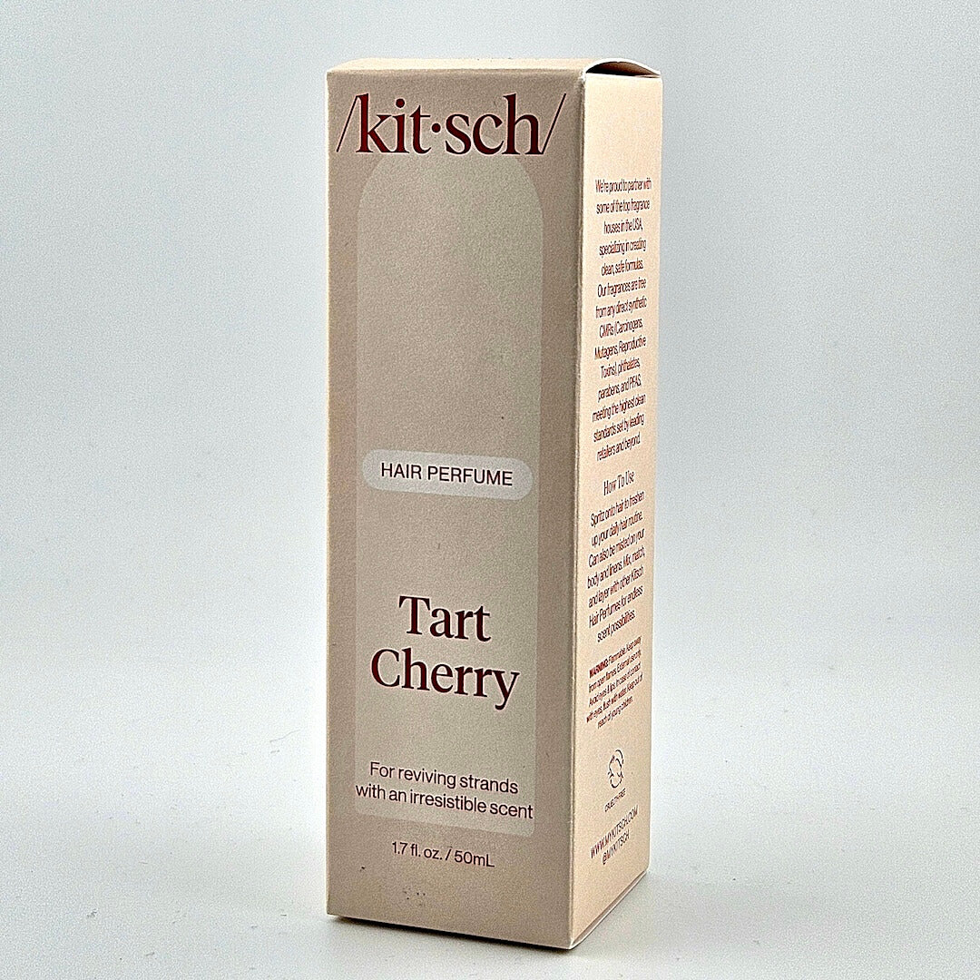 tan box of hair perfume against white background. 