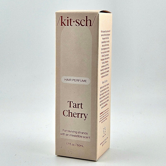 tan box of hair perfume against white background. 