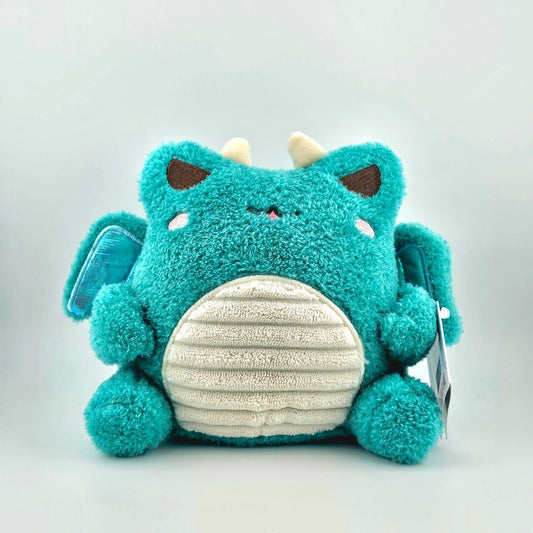 Teal winged plush animal with horns, and tag against white background.