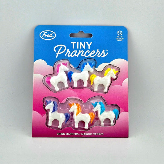 Brightly colored packaging for tiny unicorn drink charms against white background. 