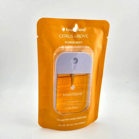Orange packaging of touchland Citrus Grove Power Mist on a white background