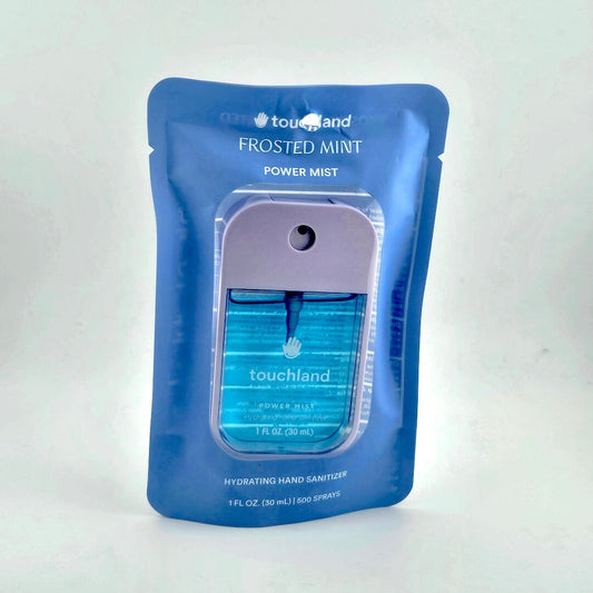 Blue packaging of Touchland Frosted Mint Power Mist on a white background