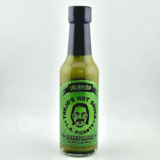 Bottle of Trejo's hot sauce with a green label on a white background