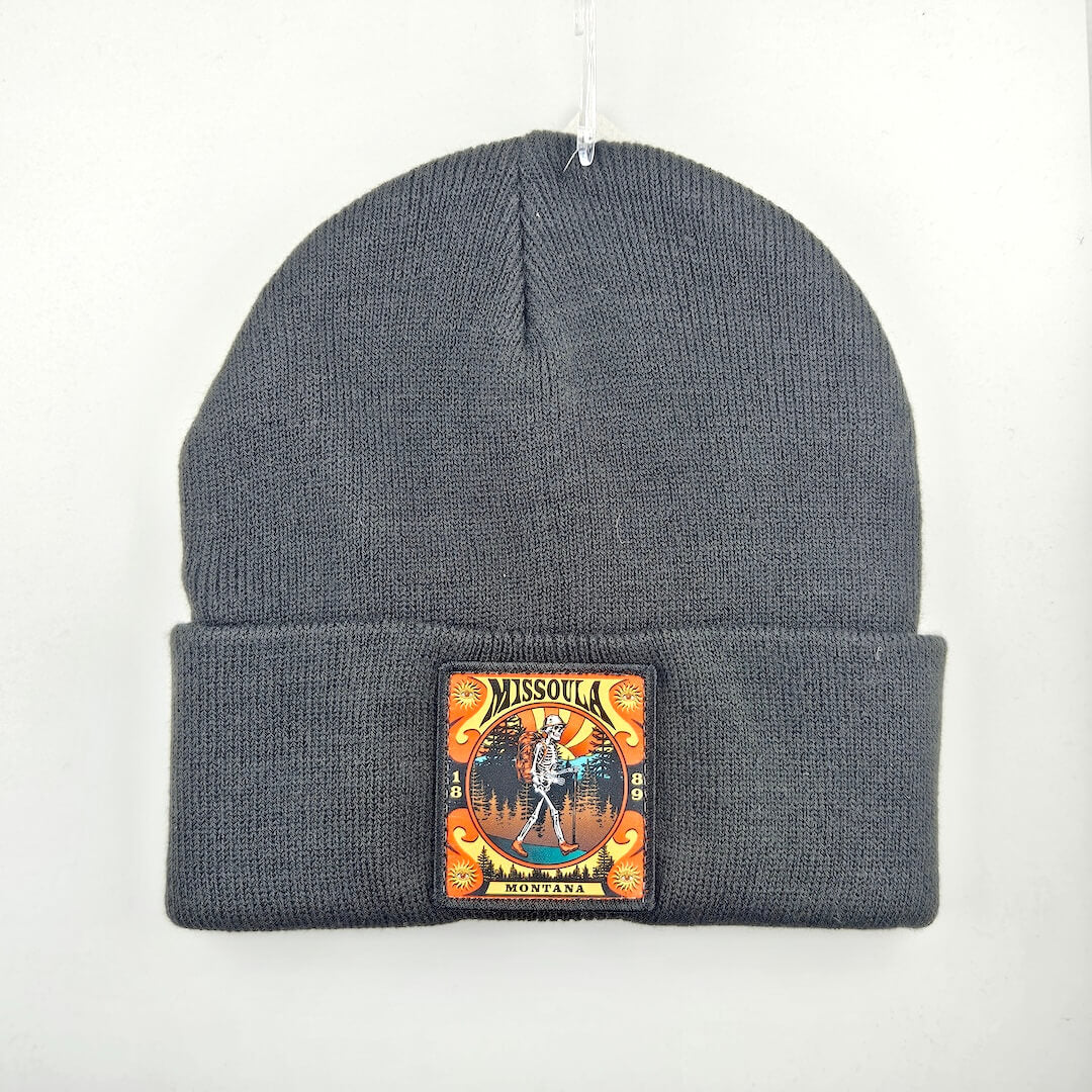 Black beanie with a colorful patch on a white background