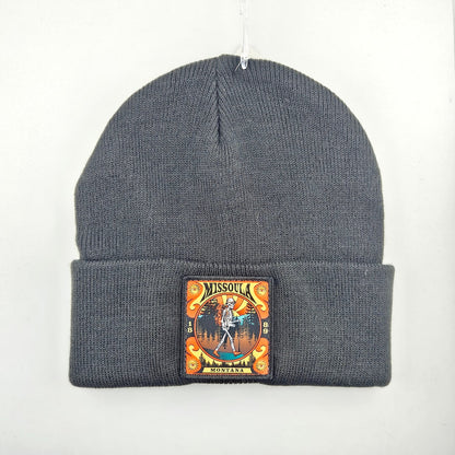 Black beanie with a colorful patch on a white background