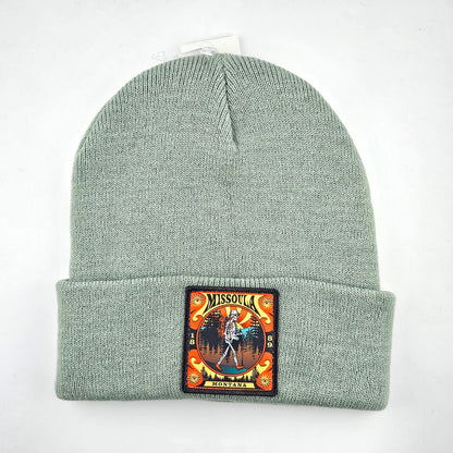 Green beanie with a patch on a white background