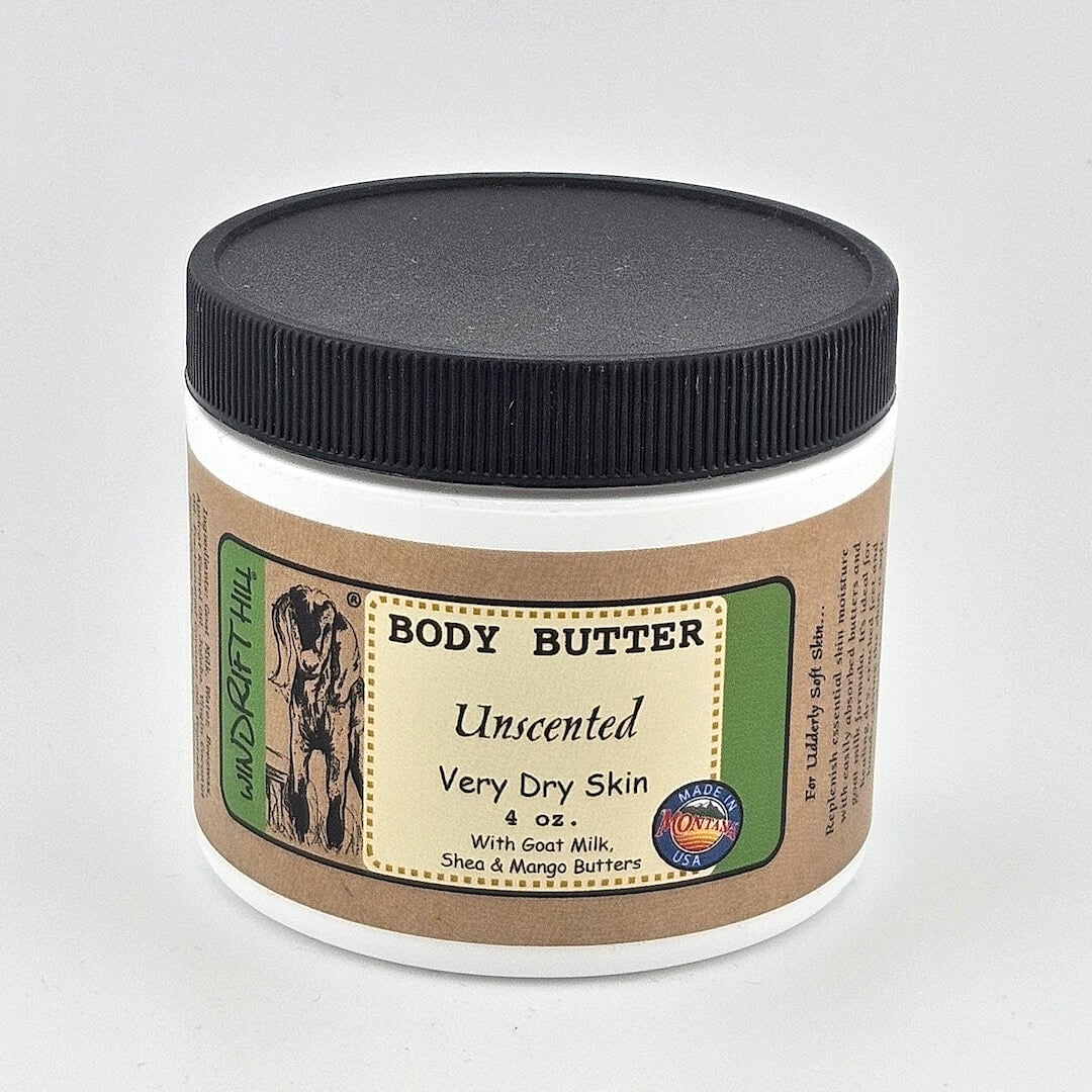 Jar of body butter with a black lid on a gray background