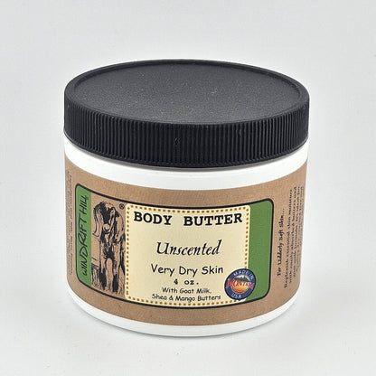 Jar of body butter with a black lid on a gray background