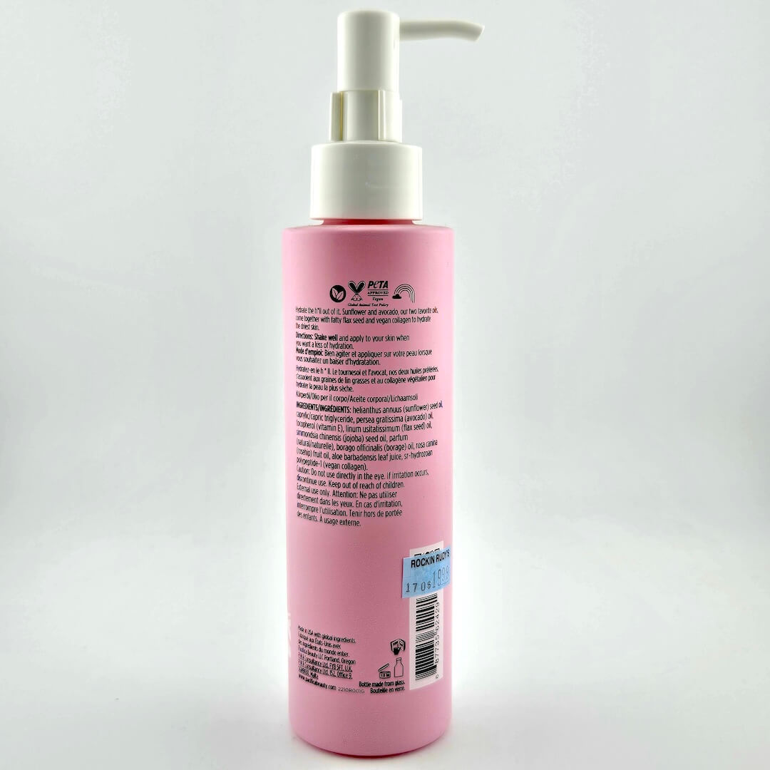 Pink bottle with pump on a white background