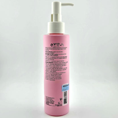 Pink bottle with pump on a white background