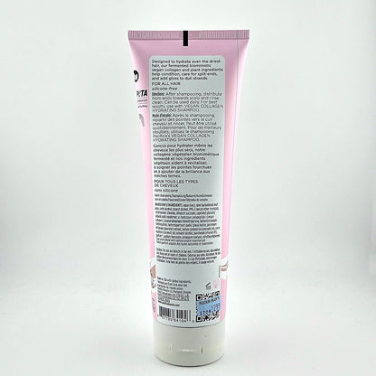 Back view of a pink shampoo bottle with text on a white background