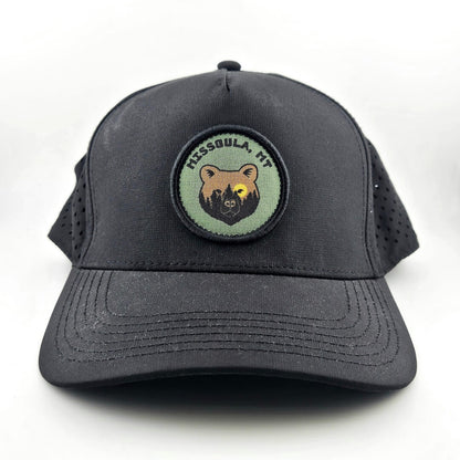 Black cap with a bear emblem and text on a white background