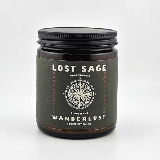 Candle jar labeled 'Lost Sage Wanderlust' on a white background