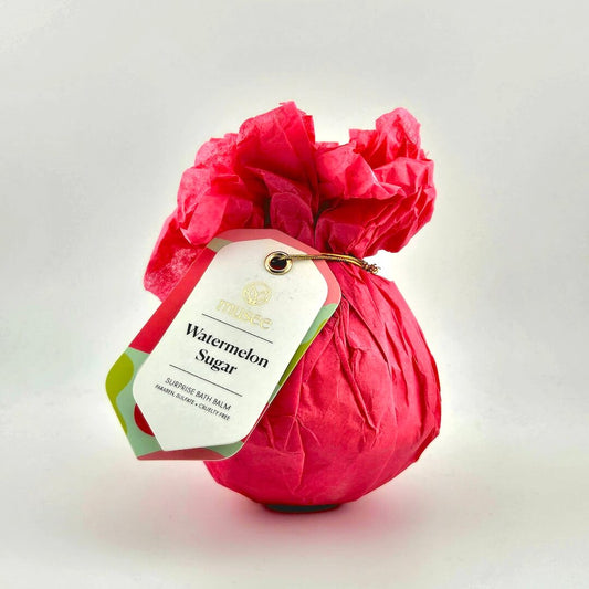 Red bag labeled 'Watermelon Sugar' with a decorative tag on a light background