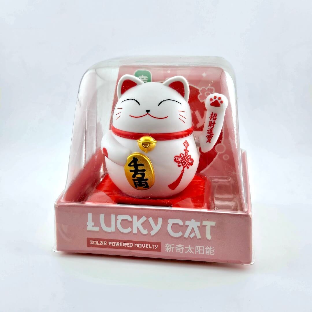 Maneki-neko (lucky cat) figurine in packaging on a white background
