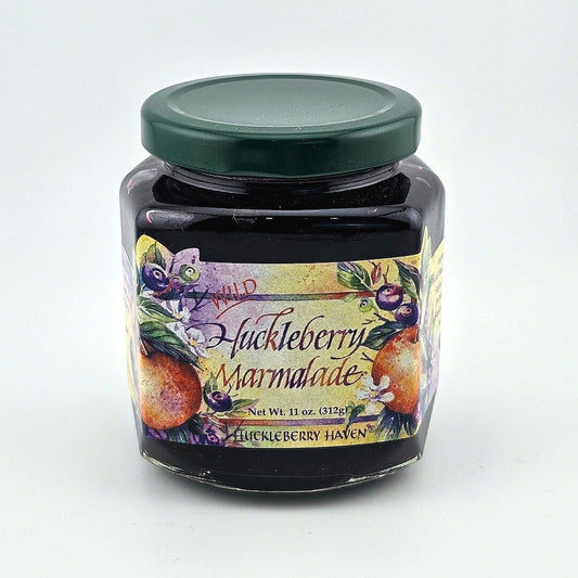 Glass jar with green lid & multicolored label with images of fruit and product information.