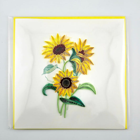 Quilled sunflower design on a white card with a yellow border