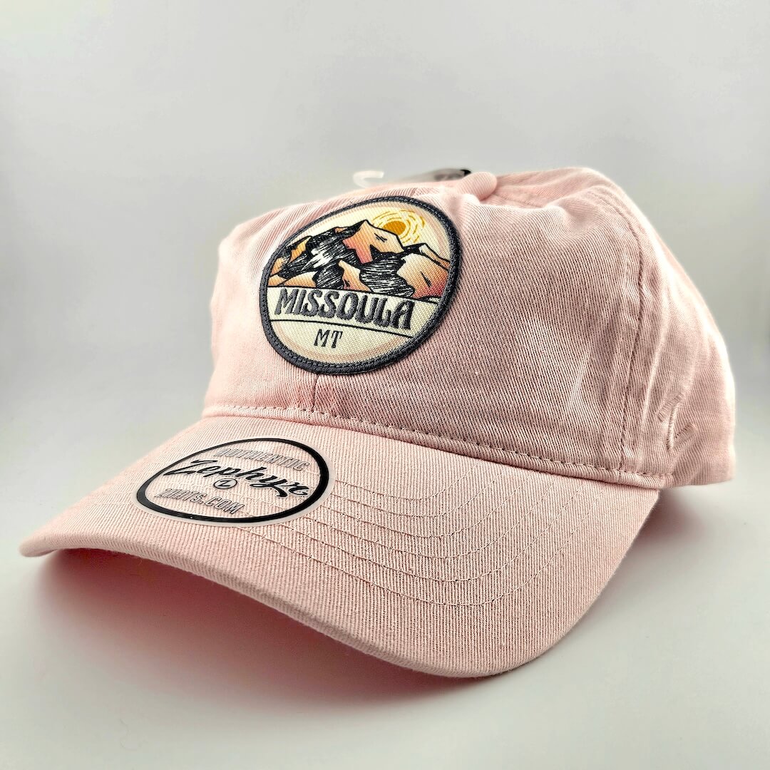 Pink cap with a patch on a light gray background