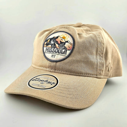 Beige cap with 'Missoula MT' patch on a light gray background
