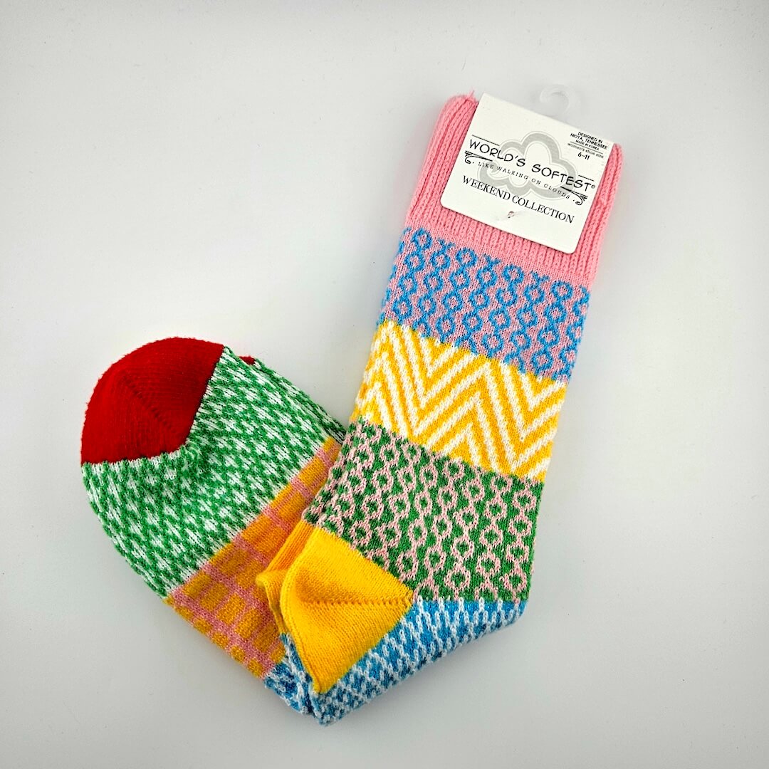 Pair of brightly colored socks with visible brand label against light gray background.
