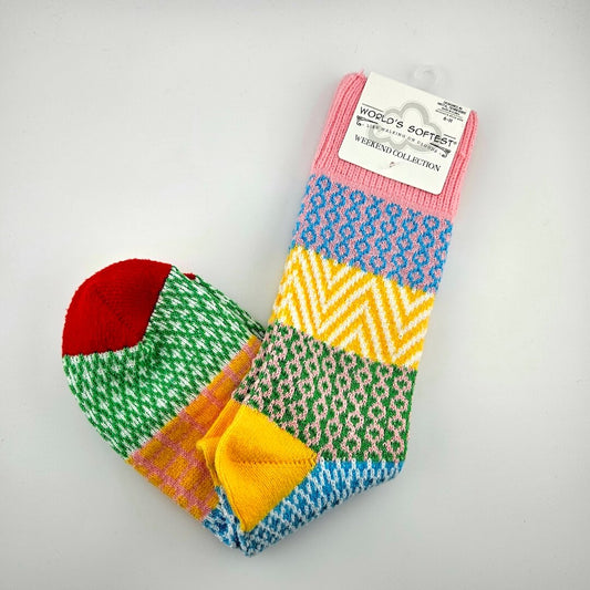 Pair of brightly colored socks with visible brand label against light gray background.