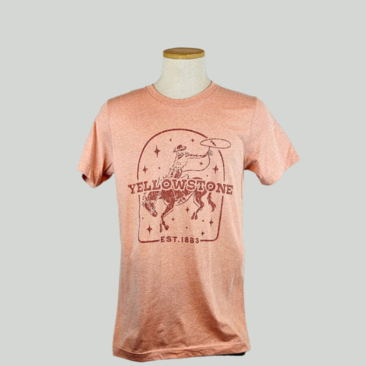 Pink t-shirt with Yellowstone graphic on a mannequin against a white background