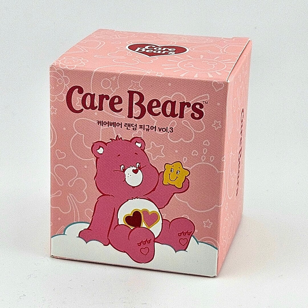 Care Bears toy box with a pink background and bear character on a white background