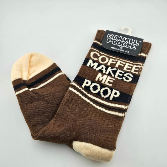 Brown socks with cream toes and heels, with black and cream stripes and text, "COFFEE MAKES ME POOP."
